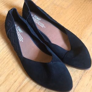 Black suede flats by Toms